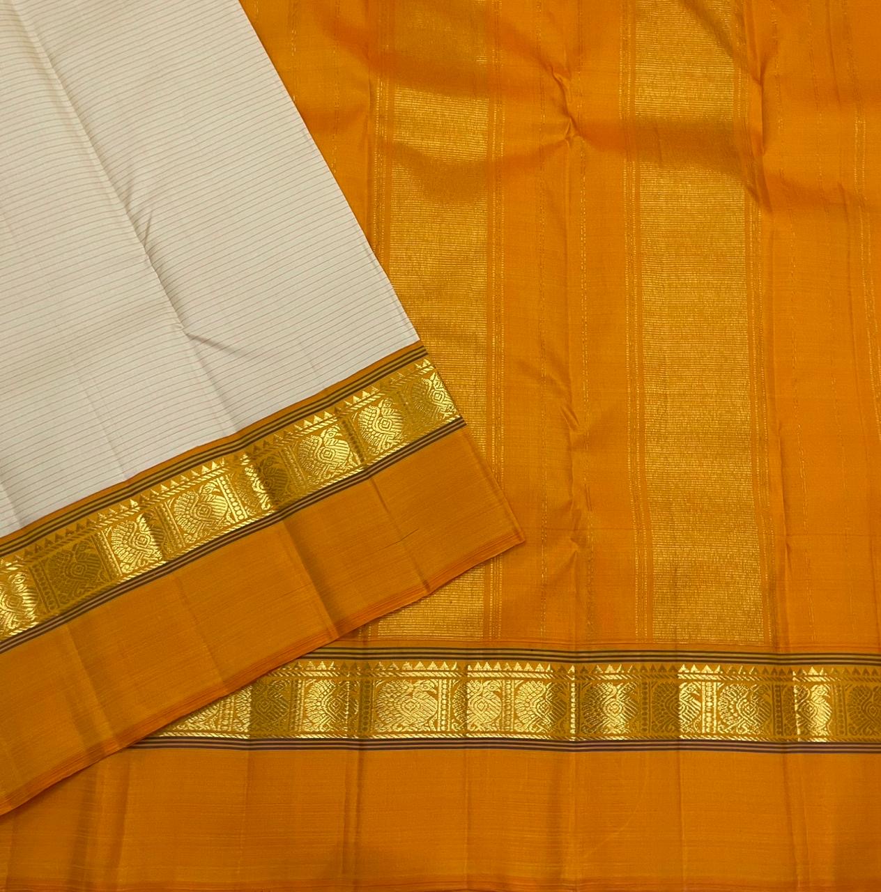 Sweta Kanakam Kattam — Pure Kanchipuram Silk Saree
Ivory Pinstripes × Marigold border with Antique-Gold Zari Border
Silk Mark Certified • Free Shipping within USA • Ships in Two Weeks