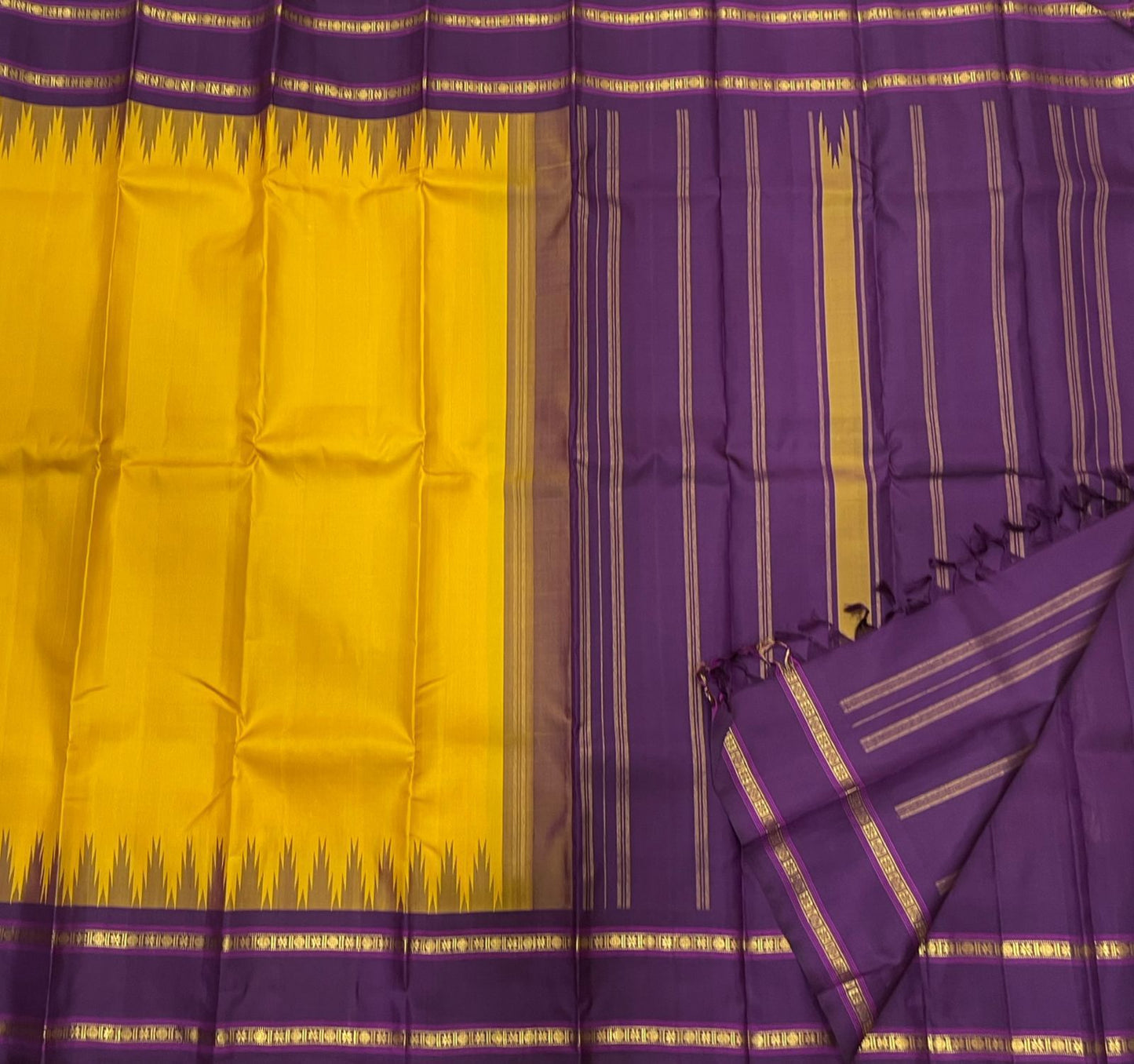 Suvarna Nitya
Mustard–Purple Kanchipuram Silk Saree
Heritage Temple Reku • Gold Zari Borders • Silk Mark Certified