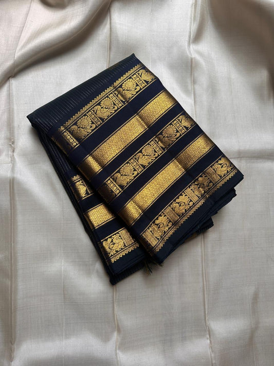 Varisaipet silk black Kanchipuram layers of gold zari work border with halo Mayil Butta body - ornate Pallu