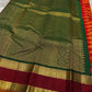 Orange Maragatha Korvai — Kanchipuram Pure Silk

Sunset aruna-orange body with delicate single zari butta

Deep maroon korvai borders with floral rosette motifs; green selvedge

Rich maragatha-green zari pallu (zari jaal & vine panels)..description