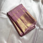 Lilac Mayil – Pure Kanchipuram Silk Saree
Ash-Lilac Body with Zari Kattam Checks & Buttas
Broad Antique-Gold Peacock Zari Borders
Grand zari Pallu 
Silk Mark Certified | Fall & Pico Done | Blouse Stitching Available | ships in two weeks Free