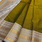 Luminous Lemon-Olive Green — White Korvai Kanchipuram

Pure Silk | Vairaoosi Checks | Korvai Contrast Borders

Classic White & Gold Pallu with Coin Jaal Motifs

Perfect for Muhurtham, Haldi & Temple Occasions

Silk Mark Certified | Free Shipping | Shi