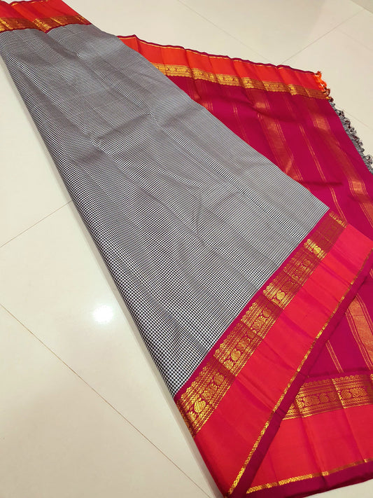 Rani Ember Podi Kattam – Pure Kanchipuram Silk Saree
Micro Black & Ivory Checks with Korvai Rani Magenta Border
Gold Zari Coin & Floral Vine Detailing with Vermilion Selvedge
Rich Rani Magenta Zari-Striped Pallu | 
Silk Mark , free shipping within 2 weeks