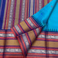 Peacock-teal body with woven silk-thread buttas in navy & coral hues
Korvai contrast ruby-maroon borders with gaja-chakram & temple motifs
Grand varisaipettu striped pallu in navy, mustard & maroon tones
Silk Mark Certified • Ships in Two Weeks