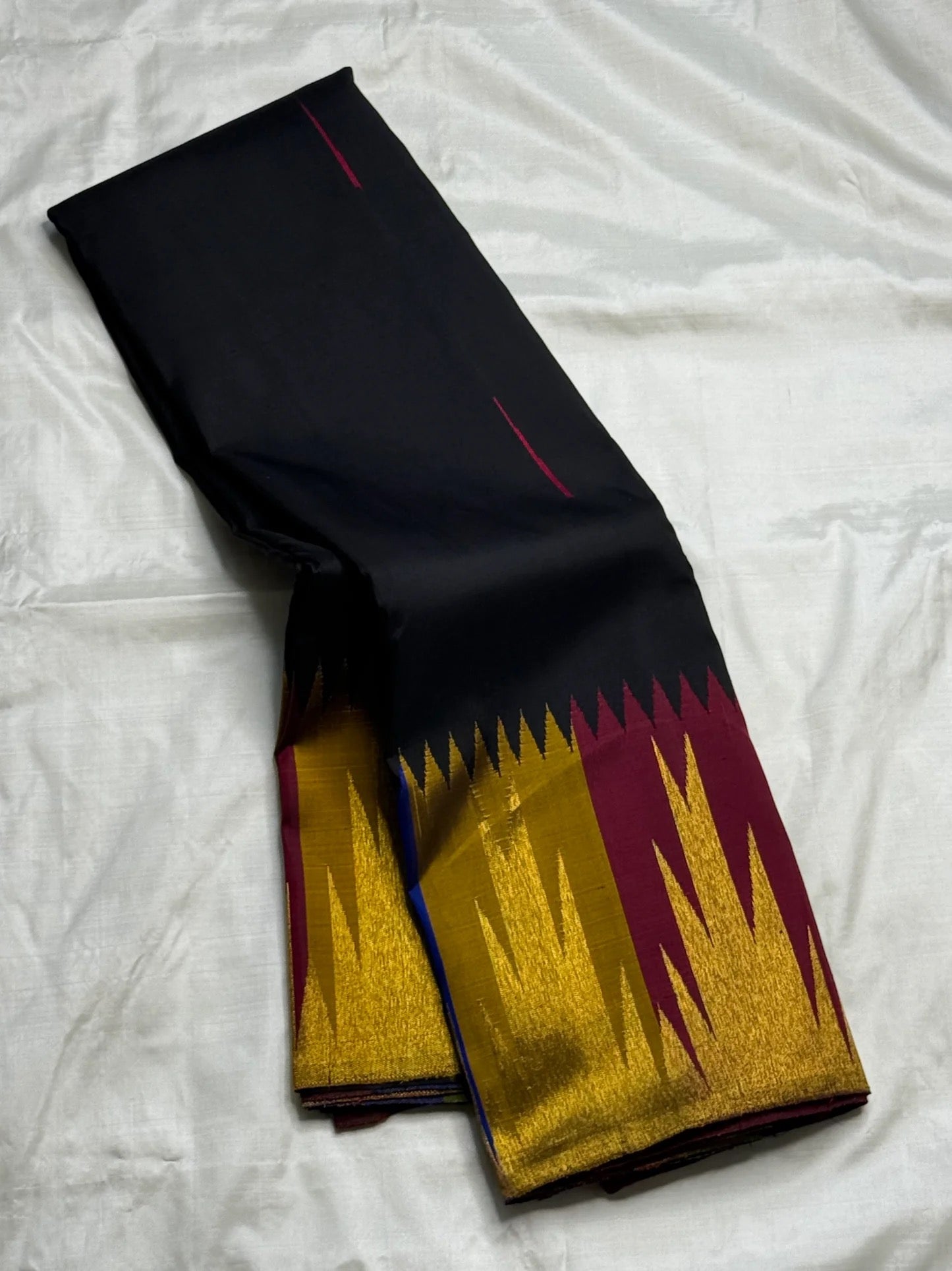 Black and gold handwoven pure silk Kanchipuram Ettukol saree with temple flame border — full overview