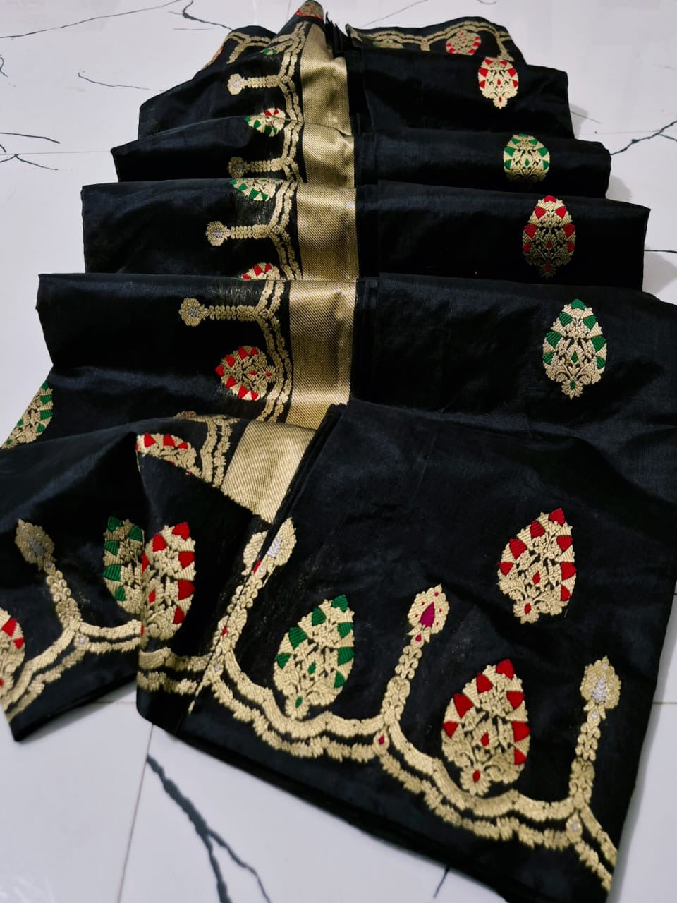 Draped black handloom Chanderi silk saree with multicolour woven border and luminous gold-toned pallu