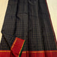 Deep red Varisaipet border with gold zari stripe and green accent on black Kanchipuram silk saree
