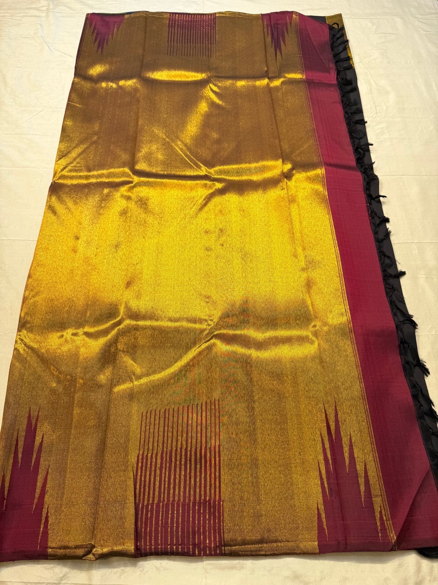 Black Kanchipuram Ettukol saree folded flat — full length view