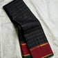Black and red Kanchipuram Zari Kattam saree folded flat — full length view