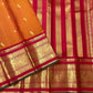 Burnt orange and crimson Korvai Kancheepuram saree folded flat view