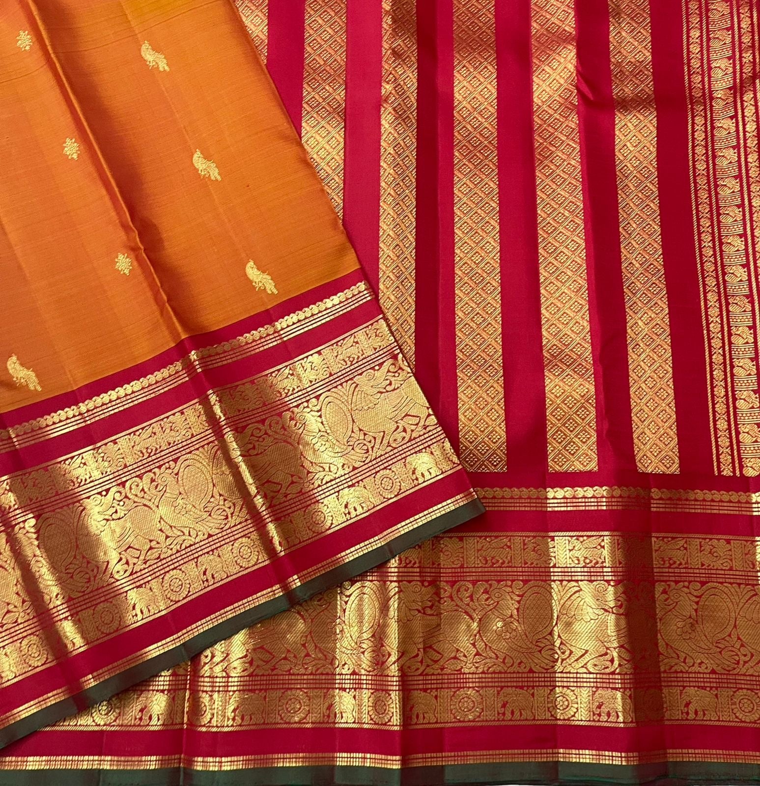 Burnt orange and crimson Korvai Kancheepuram saree folded flat view