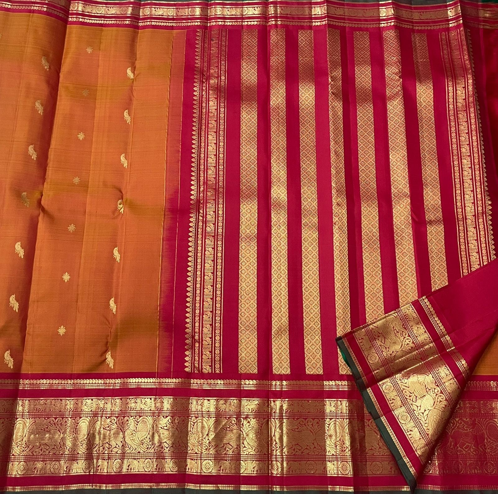 Crimson pallu with grand gold zari Yazhi motif composition on Kanjivaram saree