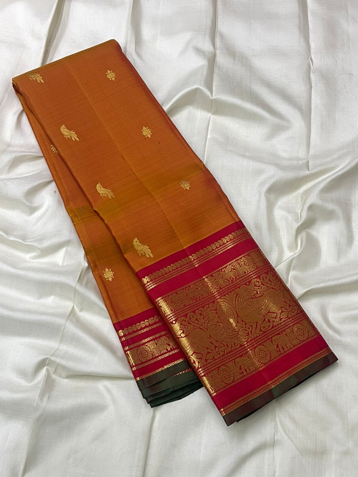 Burnt orange and crimson handwoven pure silk Korvai Kanchipuram saree with Yazhi motif overview