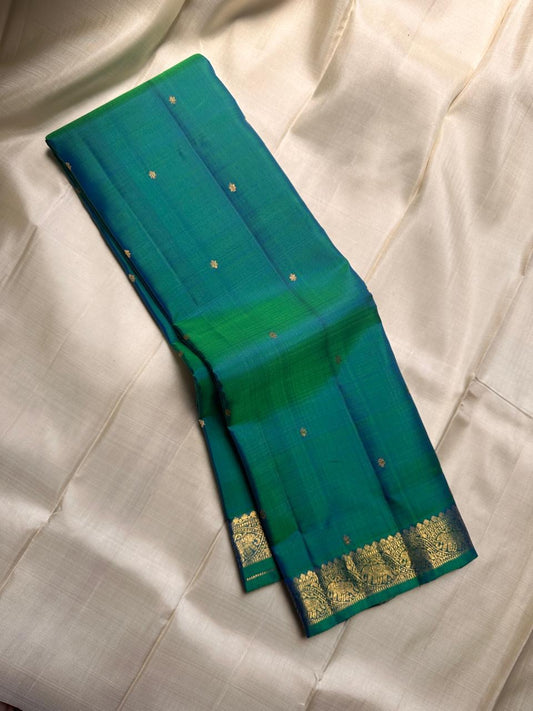 Peacock green blue shot pure silk Kanchipuram saree with vanasringaram border and Pallu