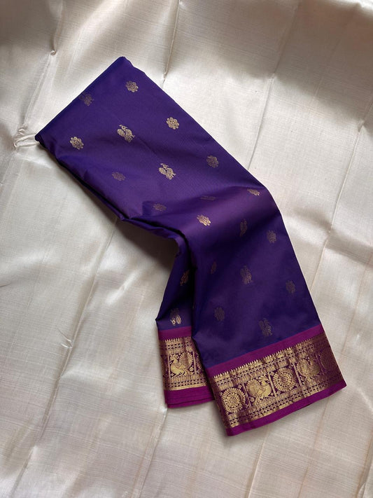 Vadamalli Mayil Chakra – Pure Korvai Kanchipuram Silk Saree
Royal purple body with gold zari paisley & medallion buttas
Contrast magenta korvai border with peacock panels; grand brocade pallu
Silk Mark Certified | Fall & Pico Done | Blouse Stitching avai