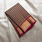 A classic Kanchipuram in Pattani Kattam checks with green, magenta, mustard, and cream.
Finished with a contrast pink border and pallu.
Paisley and chakram motifs in a graceful grid add timeless charm.