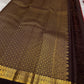 Komala – Deep Cherry Red Kanchipuram Pure Silk Saree with Coffee Brown Border
With petite kamalam motifs, peacock borders, and a grand grid zari pallu