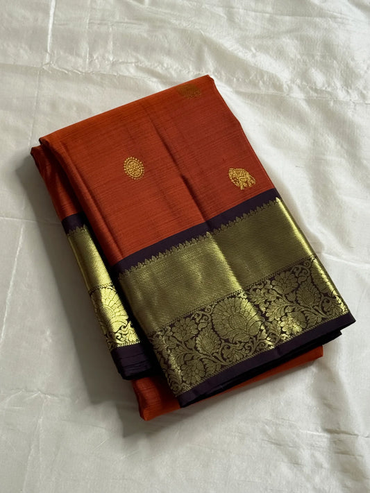 Rust orange Terracotta, Yanai Butta
 — Coffee Brown Korvai Kanchipuram
Deep coffee-brown korvai borders with wide antique-gold kaddi & floral vines
Silk Mark Certified | Free Shipping within USA | Ships in Two Weeks
Blouse Stitching available $30