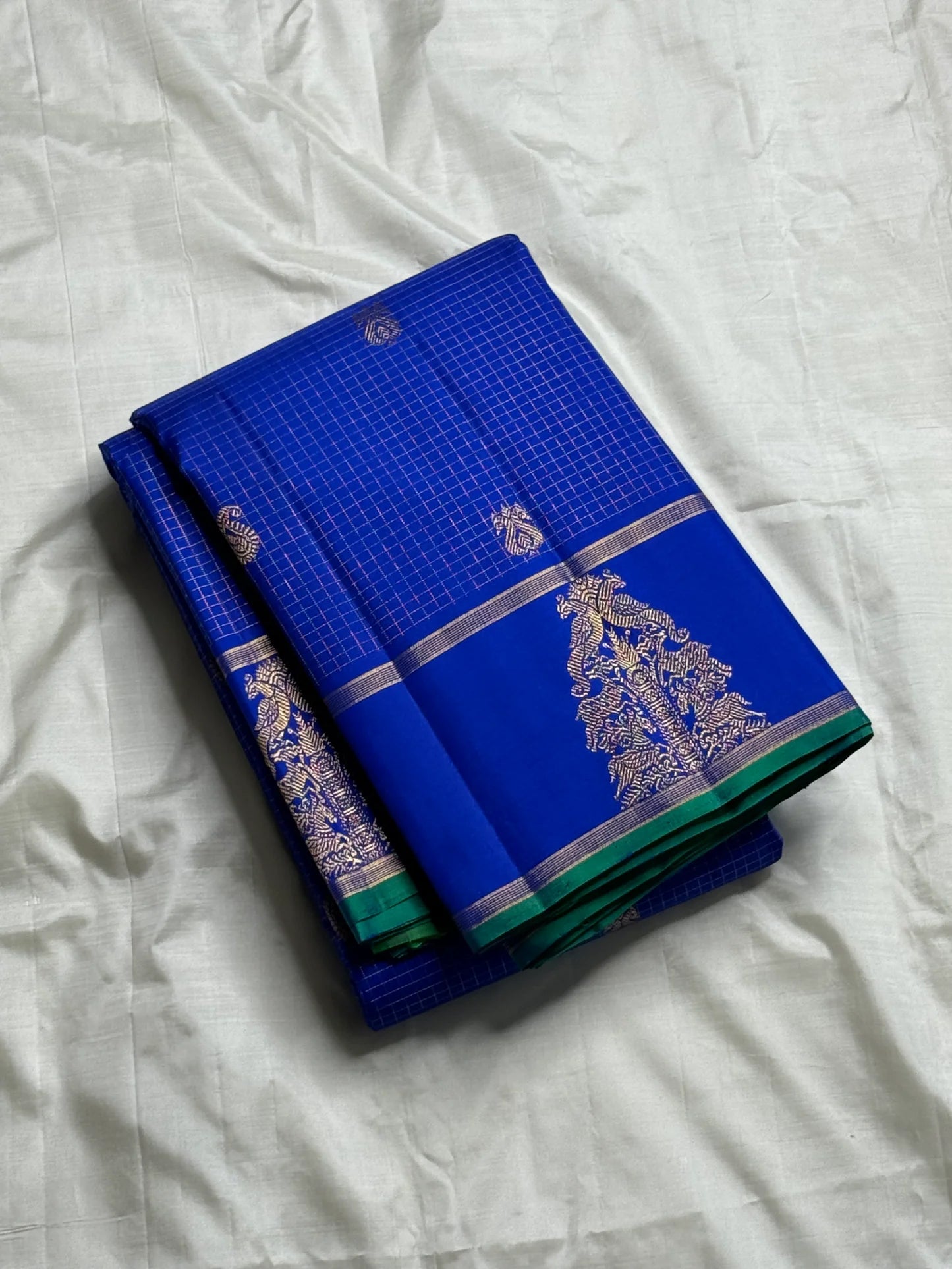 Vriksha Neelam Zari Kattam — Pure Kanchipuram Silk Saree 💙
Royal Neelam Blue with Fine Kattam Checks & Temple-Tree Zari Motif ✨
Silk Mark Certified • free shipping within Usa ,ships in two weeks