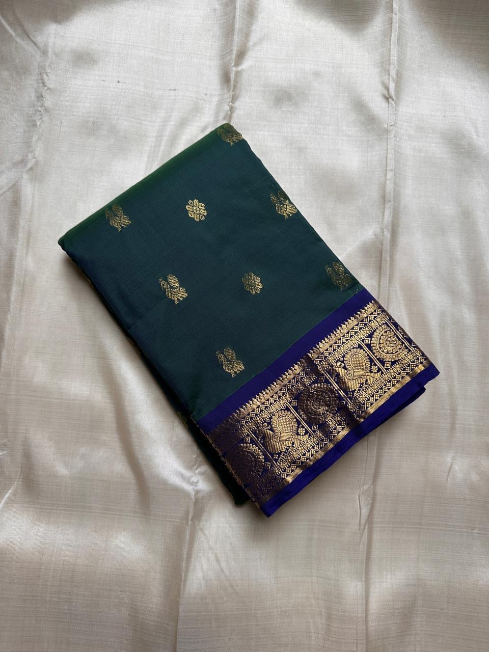 Swaram Lightweight – Enchanted Teal
Feather-Light Teal Green Kanchipuram Silk Saree
Royal Blue Zari Borders with Peacock Medallions