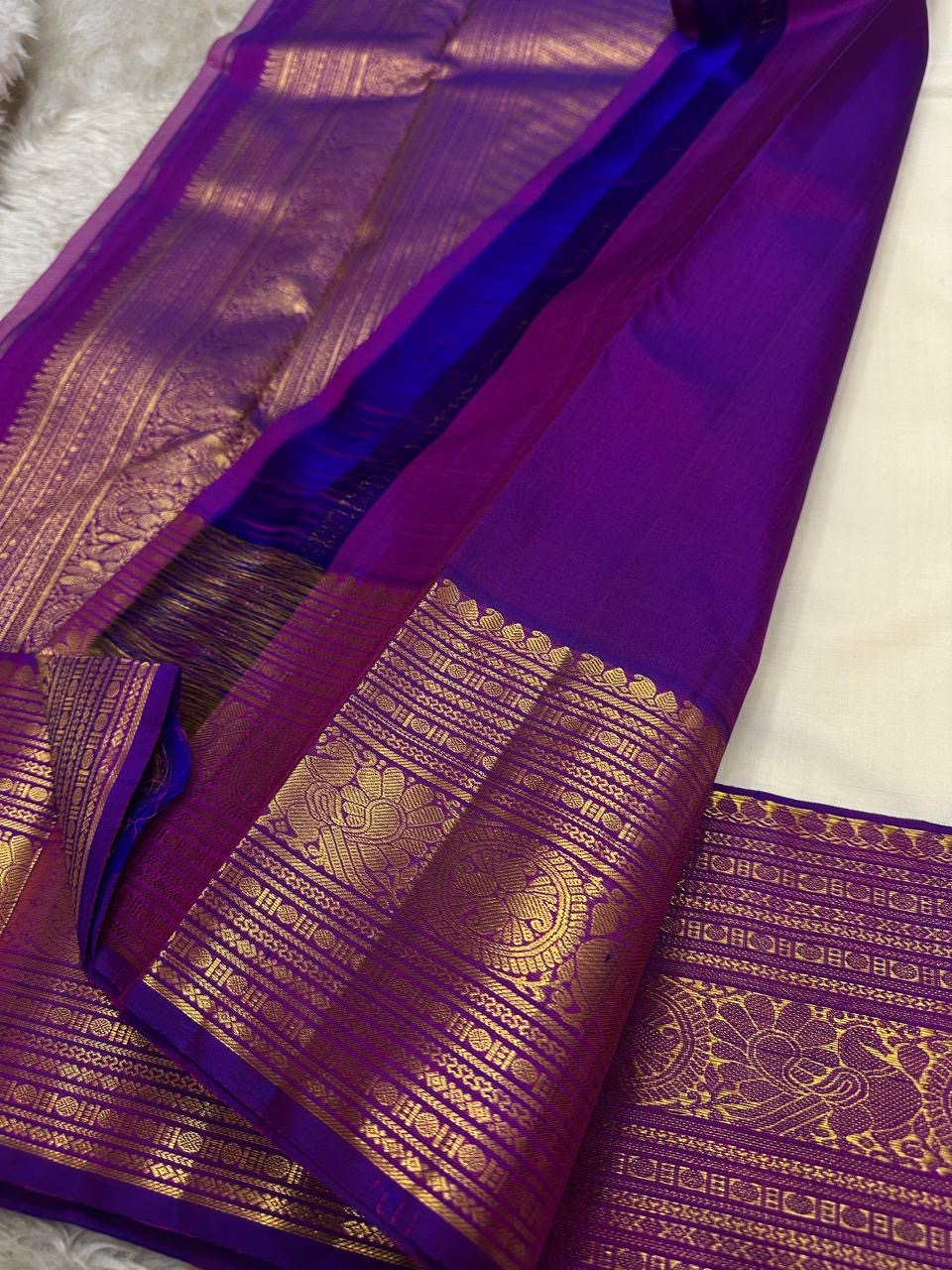 Hamsa Paisley — Pure Handloom Kanchipuram Silk Saree 
Ivory Body with Gold Paisley Buttas & Royal Purple Brocade Border ✨
Silk Mark Certified • free shipping within Usa ships in two weeks