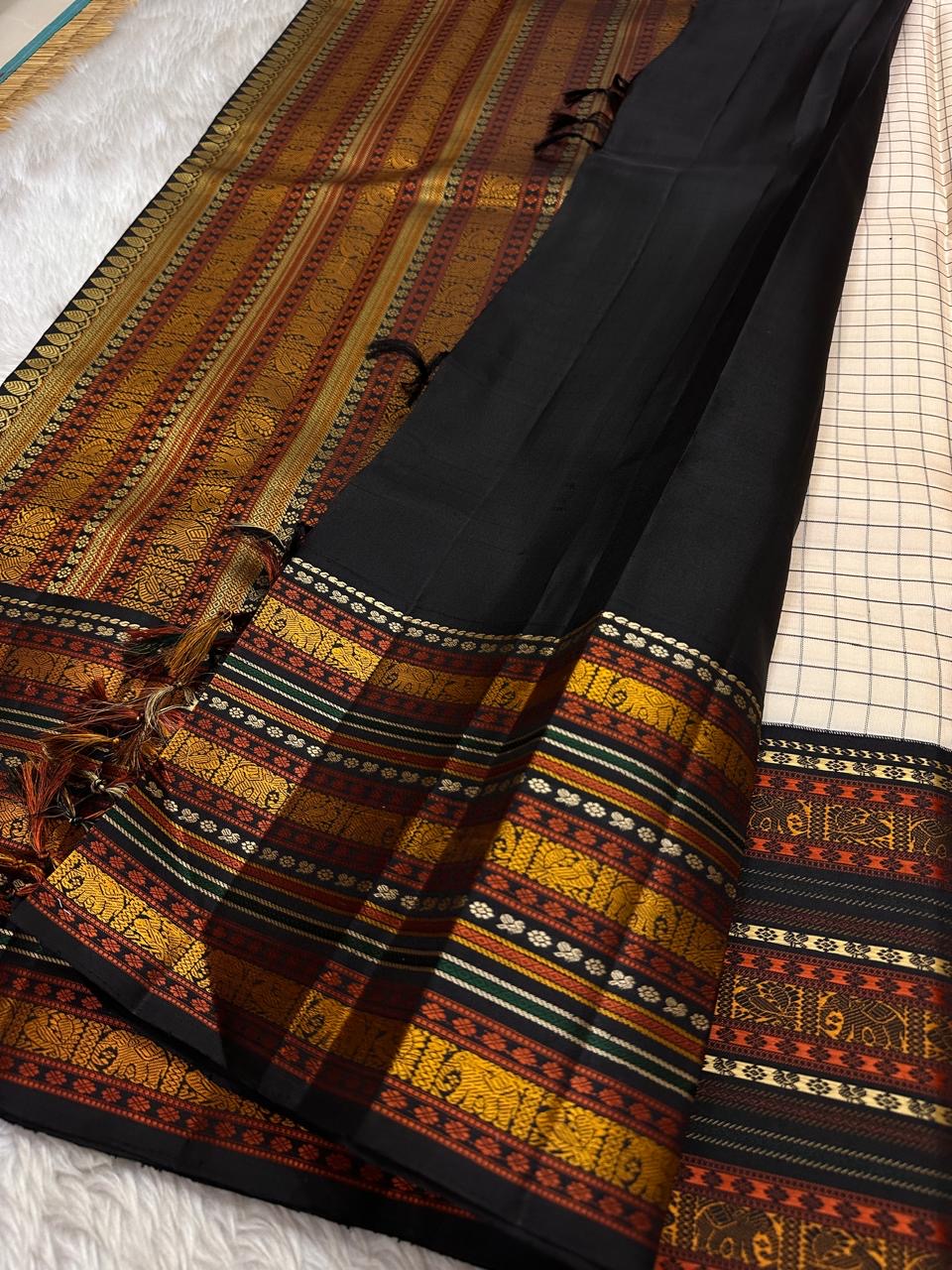 Ivory Varisaipet – Pure Kanchipuram Silk Saree
Pattunool Kattam Checks on Ivory Base
Black Borders with Elephant & Floral Motifs
Antique Gold, Rust & Bottle-Green Stripes

Silk Mark Certified, delivery in 2 weeks