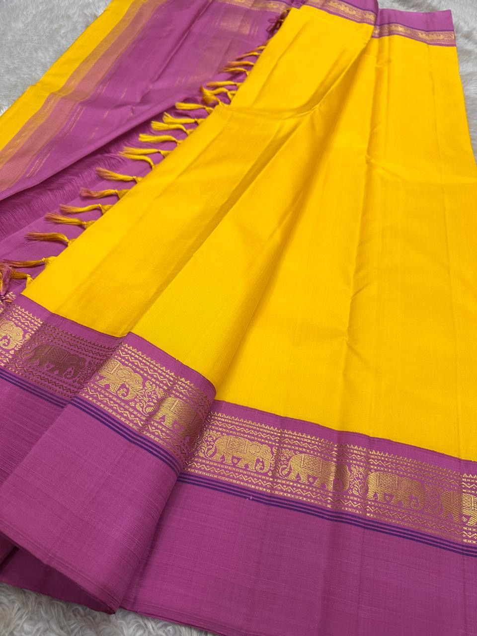 Yellow pure  Kanchipuram Silk Saree with Kaal Erangina pink Zari Border