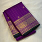 Sunanda – Royal Purple Pure Kanchipuram Silk Saree with Zari Checked Buttas & Majestic Sorgavaasal Mayil Peacock Medallion Temple Border