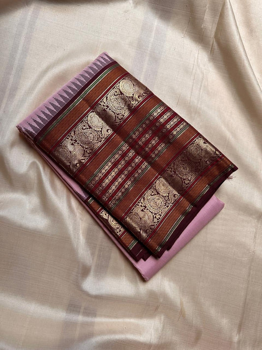 Prettiest pink shade pure silk Kanchipuram with woven zari butta ( naya paisa butta) gopuram reku in grey an am Paisley motifs , magile kannu border interspersed with Rudhraksham in varisaipettu border - elaborate Pallu in varisaipet