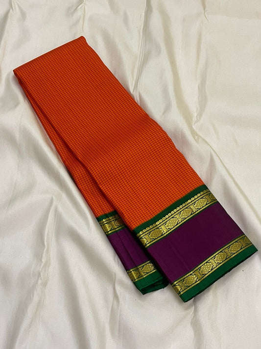 Sunset Kattam — Pure Kanchipuram Silk Saree
Sunset-orange kattam body with royal purple borders and emerald green pallu in fine zari.
Silk Mark Certified • Free Shipping within USA • Ships in Two Weeks