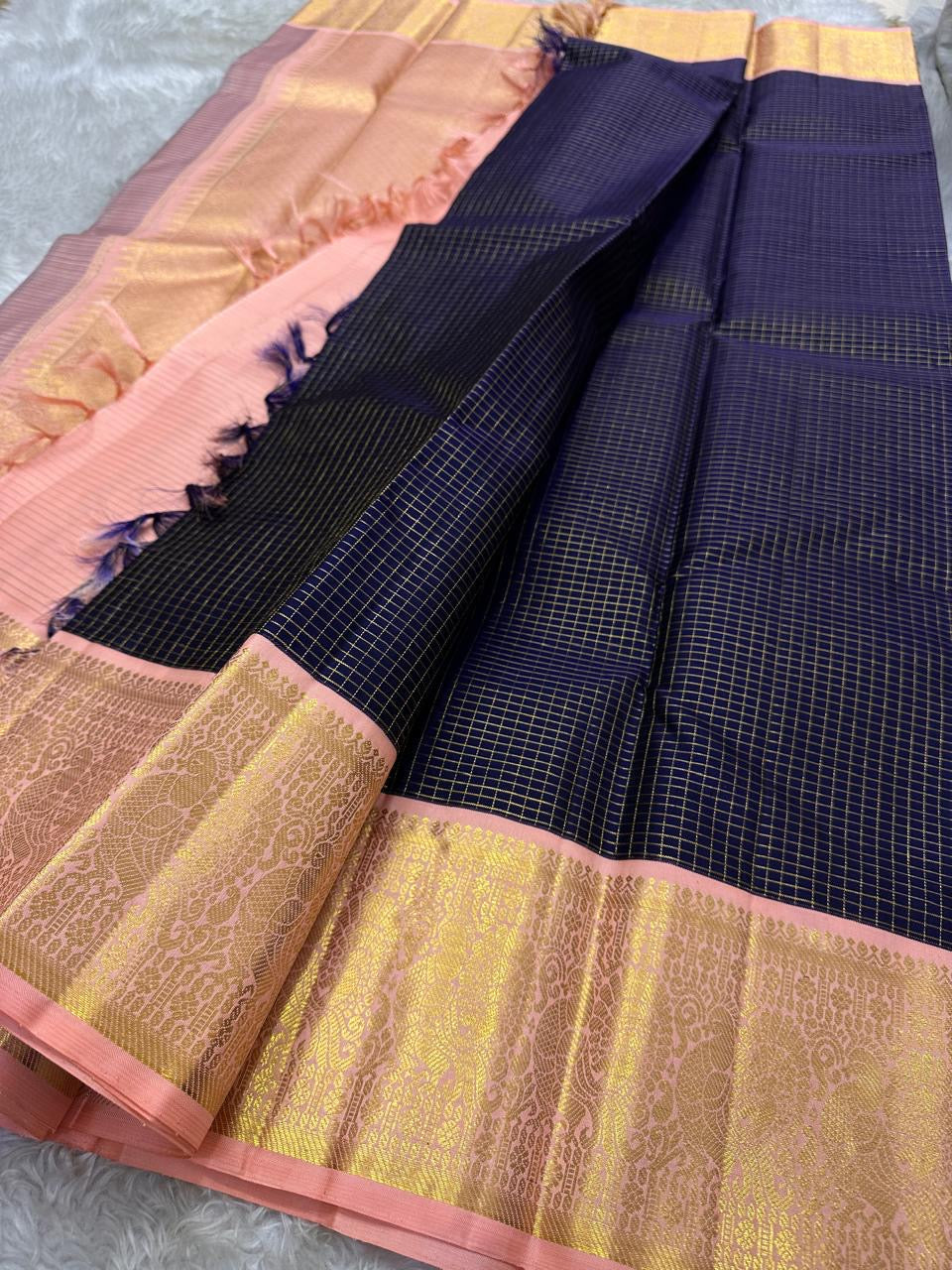 Deep navy blue Zari kattam with pink peach border peacock motif and Pallu