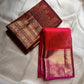 Gilded Rust – Pure Kanchipuram Silk Saree
Deep rust body with delicate paisley zari buttas 🌿
Antique-gold border featuring kaddi stripes & floral motifs ✨
Grand brocade pallu with lattice jaal & floral vines 🕊️

Silk Mark Certified, delivery in 2 weeks
