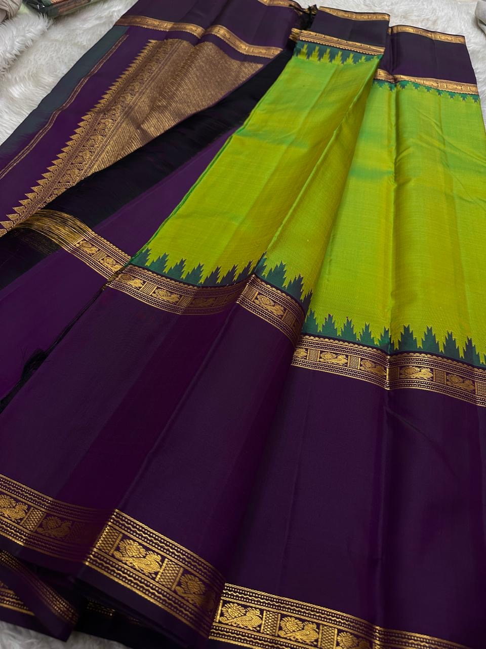 Sivakami ✨
Royal Aubergine & Parrot-Green Korvai Kanchipuram Pure Silk Saree
With Purple Thazampoo Reku Crown & Rettapet Mayil Zari Border
Grand Gold Brocade Pallu with Temple-Inspired Detailing
Silk Mark Certified | Handloom Heirloom Elegance
