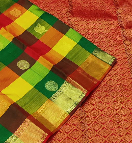 Sunset Mosaic – Paalum Pazhamum – Pure Kanchipuram Silk Saree
Vibrant Multicolored Checks in Yellow, Green, Rust & Maroon
Golden Zari Borders with Traditional Intricate Weaves

Silk Mark Certified, delivery in 2 weeks