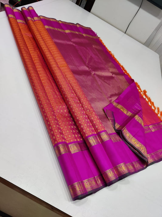 Ruby Orchid kattam – Pure Kanchipuram Silk Saree
Radiant red-orange body with fine kattam checks & zari buttas ✨
Striking magenta 2G Korvai borders woven with floral zari artistry

Silk Mark Certified, delivery in 2 weeks