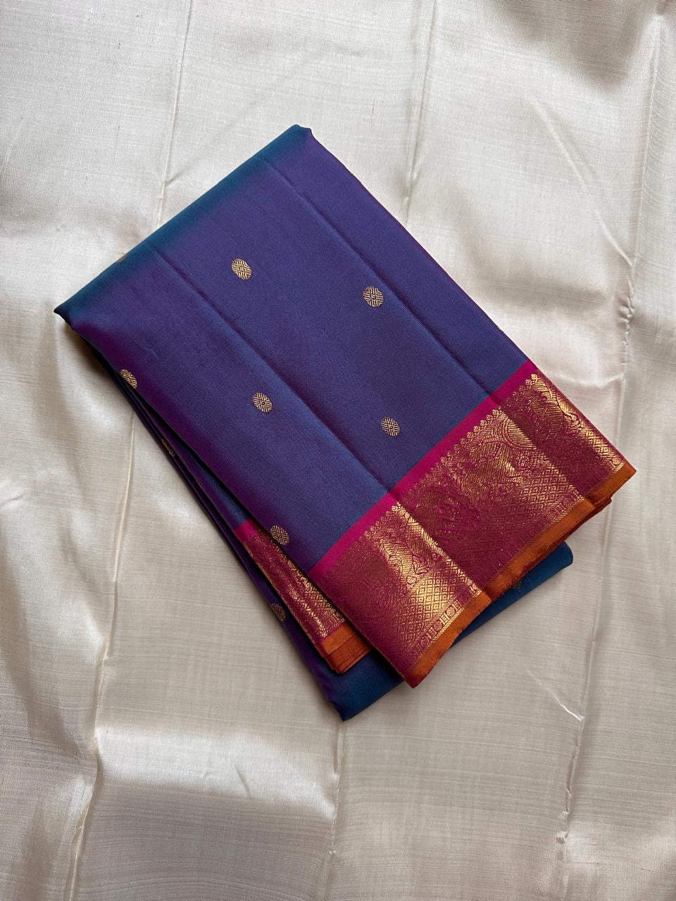 Lotus Crest Blue — Pure Kanchipuram Silk Saree Peacock–blue body with gold buttas & magenta elephant zari-woven borders Silk Mark Certified • Free Shipping within USA • Ships in Two Weeks