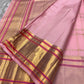 Pallu of blush pink Kanchipuram silk saree featuring rich gold zari panels and contrast pink temple borders – Idam Living