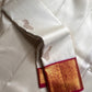 Ivory Mayil – White Mayil Butta Korvai Kanchipuram Silk Saree
Pure handloom silk | Ivory body with gold peacock buttas
Wine-maroon korvai border with peacock & floral zari motifs
Grand gold-zari brocade pallu | ships in two weeks
Silk Mark Certi