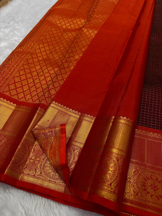 Pure silk kanchipuram a unique coffee deep brown and brick red combination , flower butta on zari checks