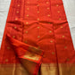 Maya
Vibrant Orange Kanchipuram Silk Saree with Lustrous Gold Coin Buttas
Handwoven Traditional Rudhraksham Seer and Intricate Arai Maadam Zari Border
Richly Crafted Pallu Featuring Elegant Gold Zari Panels for a Regal Finish