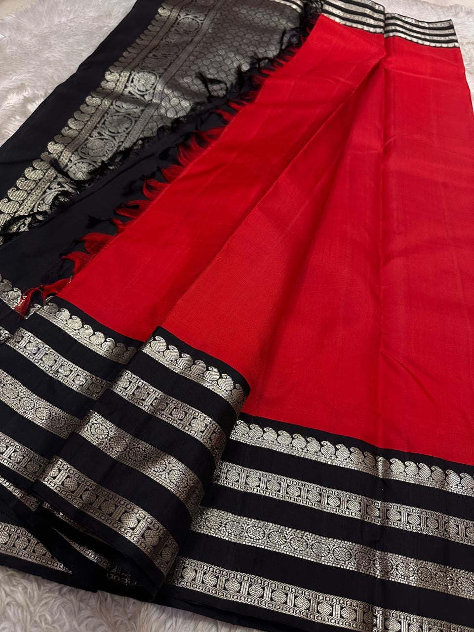 Kohl & Crimson Silk — Pure Kanchipuram Saree
Crimson body with kohl-black silver-zari borders & grand silver pallu
Silk Mark Certified • Free Shipping within USA • Ships in Two Weeks