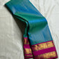 Kavi ✨ – Pure Kanchipuram Silk Saree
Teal Blue Silk Body with Lustrous Shot Weave
Rich Magenta Contrast Border in Gold Zari
Grand Pallu with Intricate Kili (Parrot) Motifs
Magenta Blouse with Matching Zari Border Silk Mark Certified, delivery in 2 weeks
