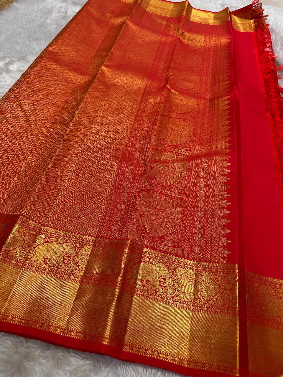 Srija – Red-Orange zari kattam  Kanchipuram Pure Silk Saree with Zari Checks, Kamalam Buttas & Vanasringaram Border