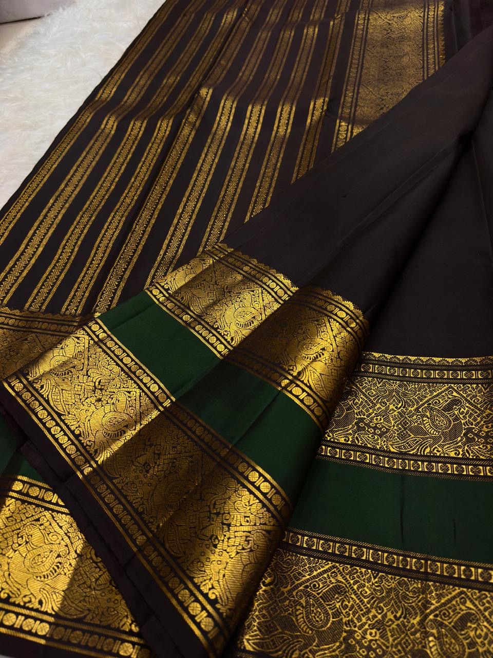 Border edge showing deep brown and bottle green and finely finished zari selvedge on Kanchipuram silk