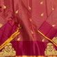 Draped maroon zari kattam saree showing tassels, gold elephant motifs, and wine border with large thiruvizha motif.