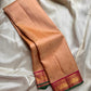 Pure silk kanchipuram Biscuit beige  color body with zari buttas , magenta mayil border with green selvedge