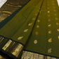 Olive Pachai – Pure Korvai Kanchipuram Silk Saree
Olive green body with gold zari gaja & medallion buttas
Contrast black korvai border with peacock & floral vines
Grand brocade pallu with lattice & temple patterns
Silk Mark Certified …chk description