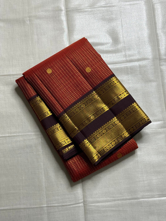Amber Cocoa – Pure Kanchipuram Silk Saree
Warm cocoa-brown body with elegant zari kattam checks & buttas ✨
contrast border richly woven with zari motifs
zari pallu adorned with intricate patterns
Silk Mark Certified, ships in two weeks