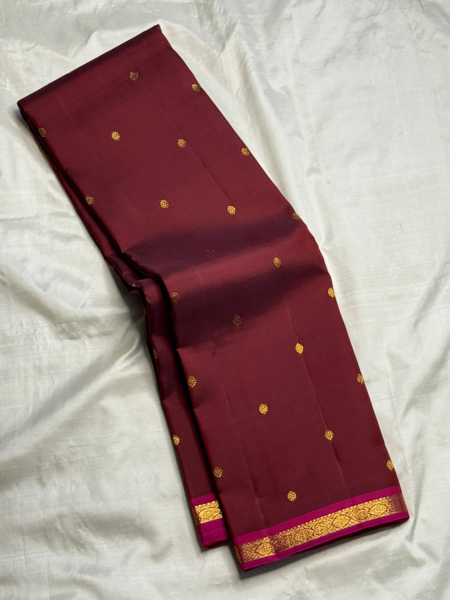 Handwoven deep maroon Kanjeevaram silk saree with delicate floral butta motifs Idam Living