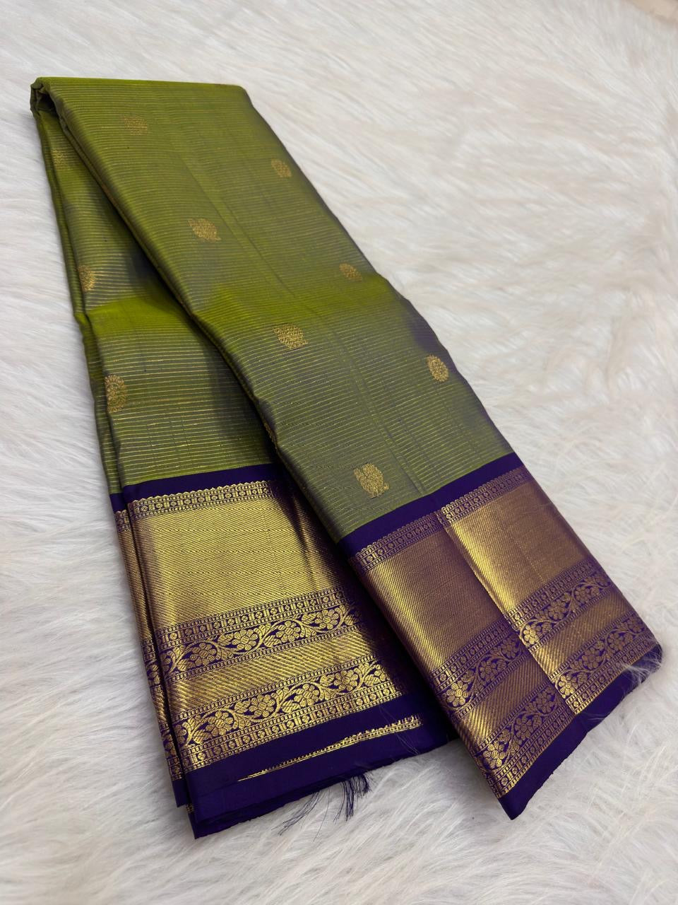 Olive green pure silk Kancheepuram Vairaoosi saree with fine zari lines, full drape view